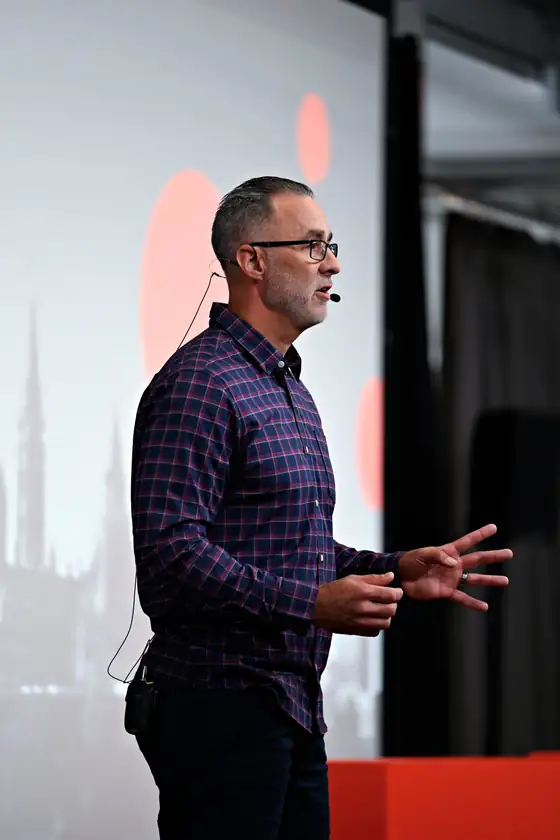 Jay Smith speaking on stage